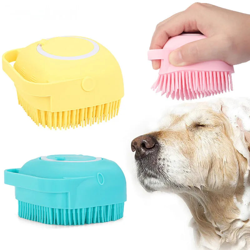 Soft silicone dog bath brush with shampoo dispenser in yellow, pink, and blue colors being used on a happy dog during bath